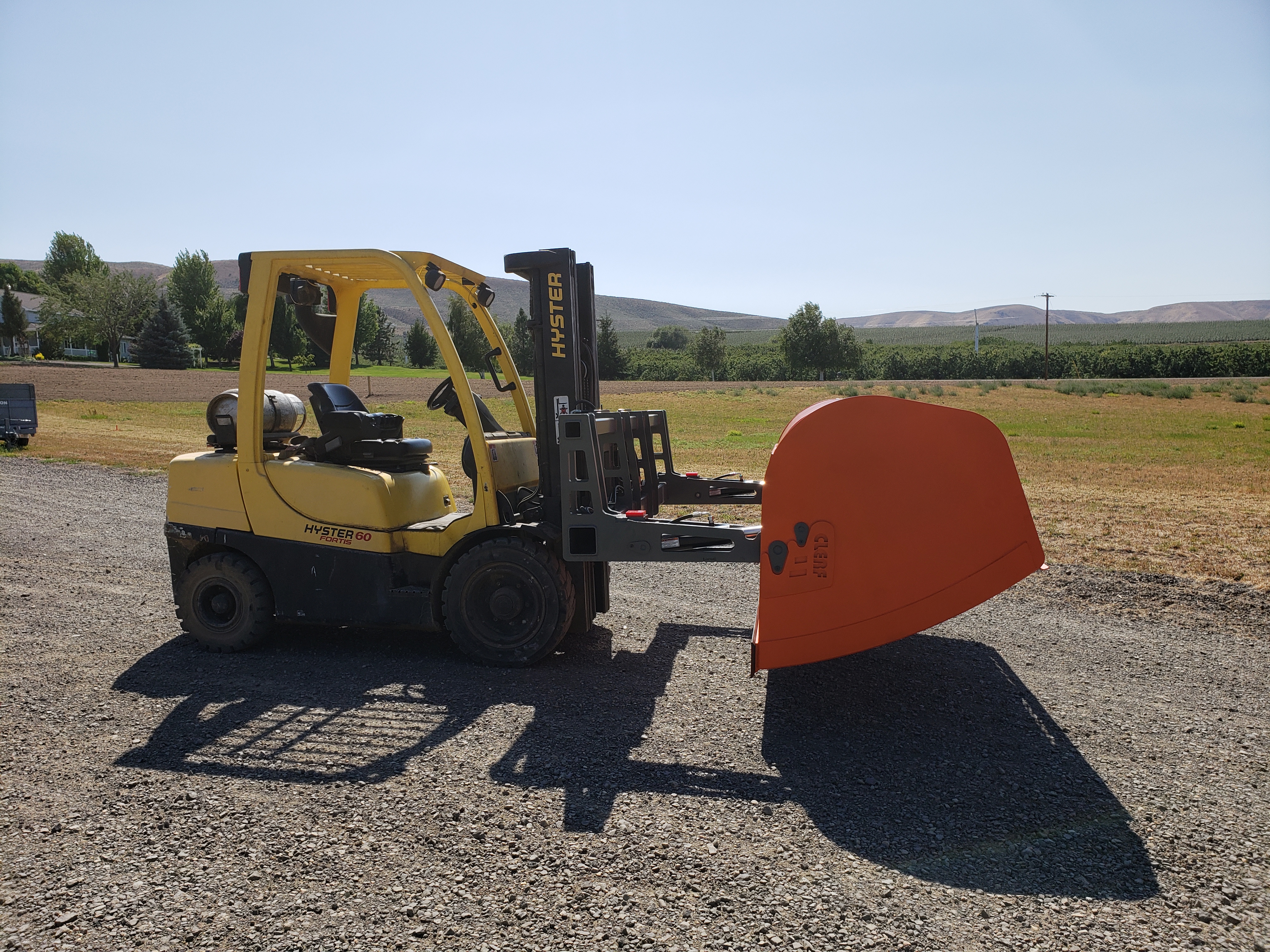 Clerf Standard Hay Clamp on CAT Wheel Loader loading Hay Truck